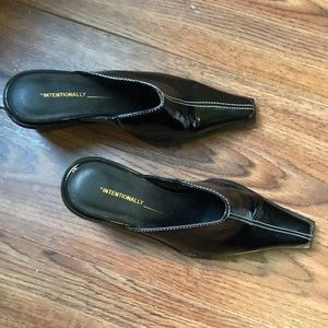 Intentionally blank black patent mules. 90s vibes.